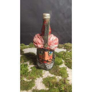 Butelka z wyrzeźbioną twarzą